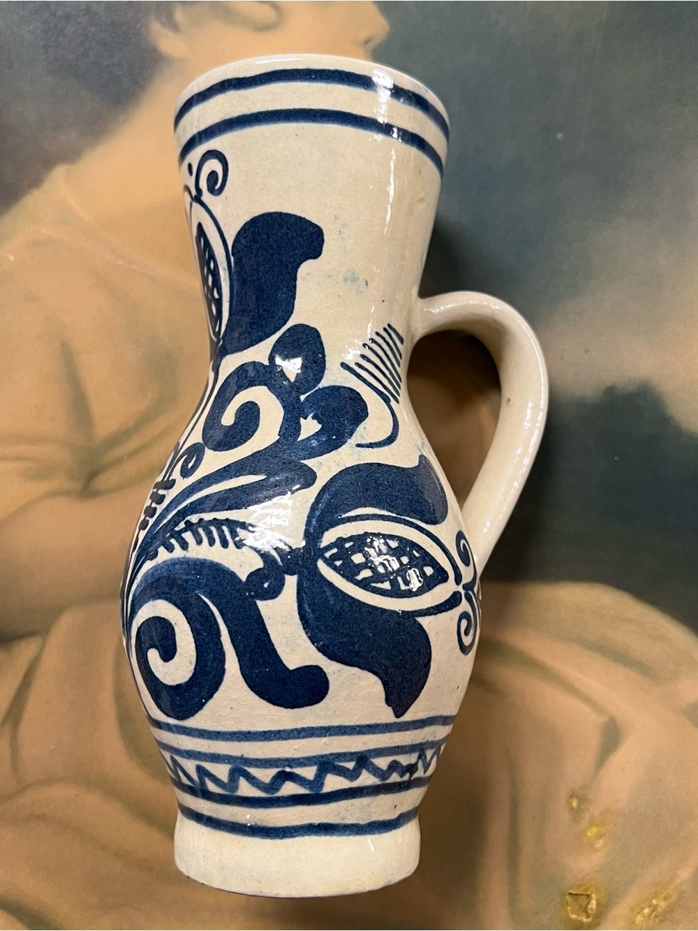 Hand-Painted Blue and Cream Ceramic Pitcher